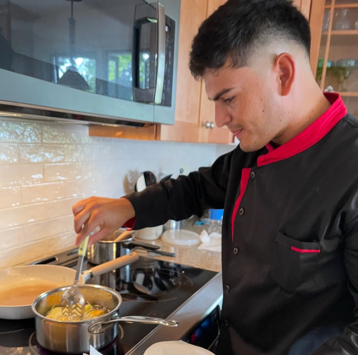 Chef David cooking at a residential kitchen range